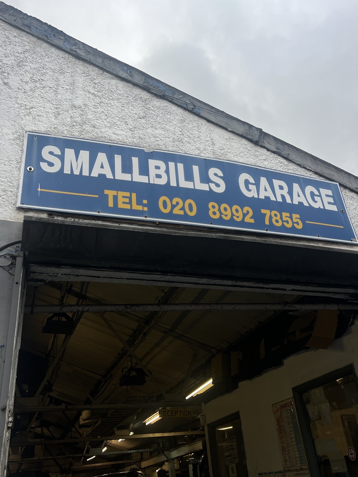 Gearbox and mechanical parts on the floor of the workshop at Smallbills Garage Ltd & Tyre shop